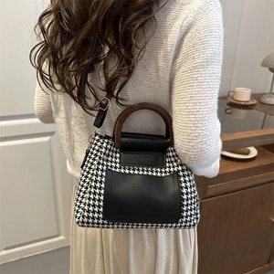 Houndstooth Boston bag with dark brown wooden handle and black leather details for women