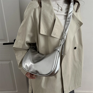 Metallic silver crescent hobo bag for women with a glossy finish and fashion lettering