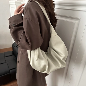 Minimalist cream white oversized pleated hobo bag in soft pebbled leather for women
