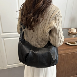 Minimalist black pleated hobo bag with large capacity and knotted shoulder strap