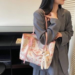 Minimalist cream tote bag with pink graffiti print and cute rabbit plush charm