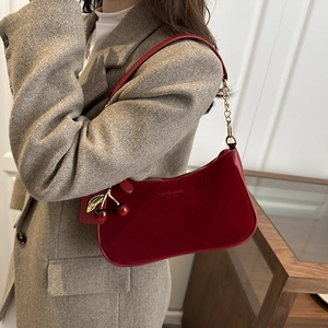 Fashionable red underarm bag with cherry pendant and metal chain shoulder strap for women