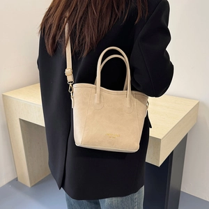 Chic cream leather mini tote bag with crossbody strap and Fashion & Bag 1985 text