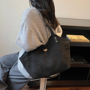 Classic black suede tote bag with golden lock and wide shoulder straps for women