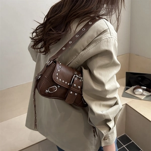 Dark brown faux leather shoulder bag with silver rivets and punk motorcycle style design