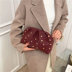 Chic dark red pleated clutch bag with golden rivets and subtle leopard print texture