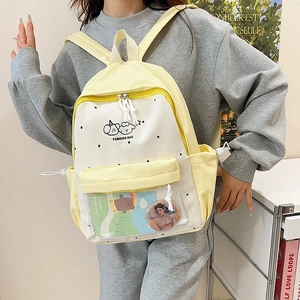 Kawaii beige polka dot backpack for girls featuring a clear PVC window for pin display