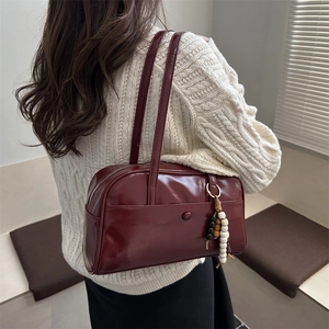 Minimalist burgundy faux leather pillow shoulder bag with retro beaded charm accessory