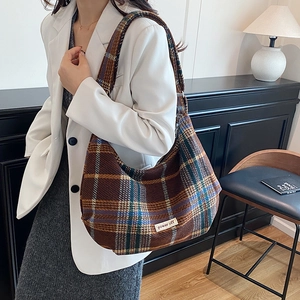 Brown houndstooth pattern large tote bag with power off label in vintage British style