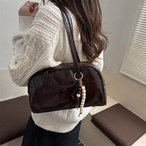 Chic dark brown faux leather pillow bag with stylish bead tassel for women's daily commute