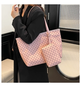 Pink tote bag set with geometric print shown on model wearing black blazer outfit