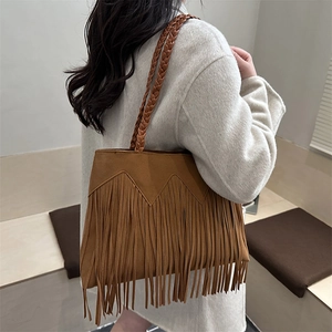 Vintage brown suede fringe tote bag with woven shoulder straps in bohemian style
