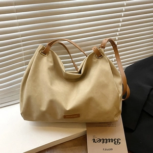 Vintage khaki large capacity tote bag with brown leather straps for daily commute use