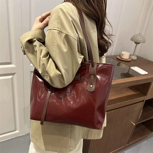 Vintage large burgundy patent leather tote bag with brown straps for women's daily commute