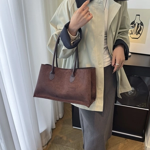 Minimalist brown suede tote bag for women showing a retro shoulder bag aesthetic