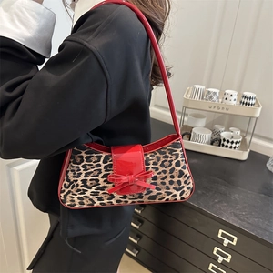 Vintage leopard print shoulder bag with red patent leather trim and bow detail