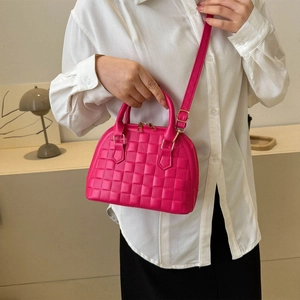Quilted rose red shell bag with gold hardware and top handle for women
