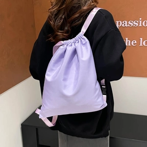 Minimalist light purple nylon drawstring backpack for women featuring adjustable straps