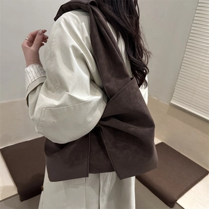 Brown suede crossbody bag with artistic bow shoulder strap for women casual fashion