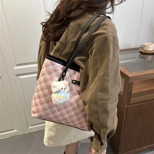Pink checkered tote bag with black leather straps and plush charm for women's daily commute