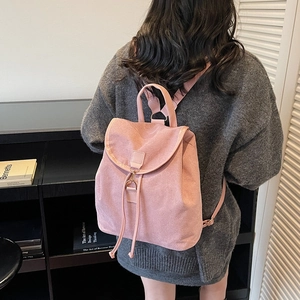 Fashionable pink suede backpack for women with drawstring and flap cover design