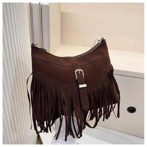 Detail of dark brown suede tassel bag featuring vintage crescent shape and golden buckle