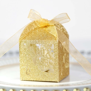 Glittery gold Mr & Mrs laser-cut wedding favor box with elegant chiffon ribbon detail