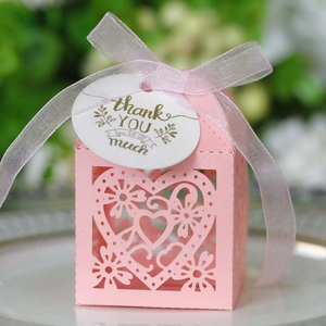 Pink heart laser-cut candy gift box with light pink ribbon and thank you tag