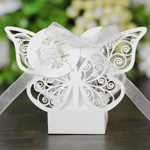 White laser-cut butterfly candy box with ribbon and gold foil Thank You tag for weddings