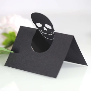 Halloween black skeleton head place cards for festive party table decorations