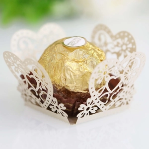 Elegant beige laser-cut heart pattern chocolate wrapper for wedding party table decor