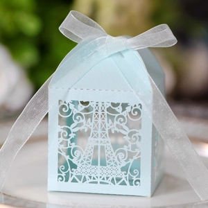Elegant light blue laser-cut Eiffel Tower candy box with a white silk ribbon bow