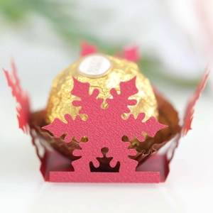 Hollow red snowflake paper holder for Ferrero chocolate with laser cut floral design