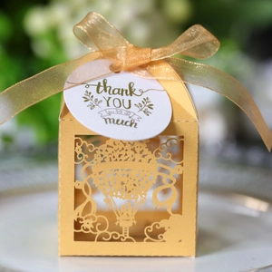 Elegant gold laser-cut hot air balloon gift box with ribbon and thank you tag for weddings