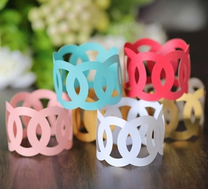 Elegant laser cut paper napkin rings set in multiple colors for wedding party table decor