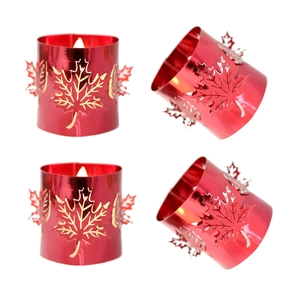 Glossy red metal maple leaf hollow candle holder four-piece set with elegant leaf patterns