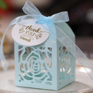 Light blue laser cut rose gift box with silk ribbon and thank you tag for weddings