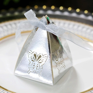 Elegant hollow butterfly pyramid candy box in silver mirror finish with ribbon