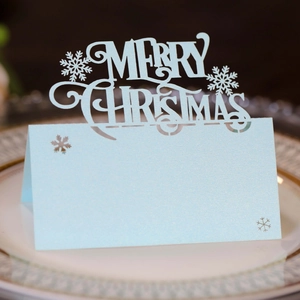 Marque-place de Noël bleu clair découpé au laser avec flocon de neige et texte festif