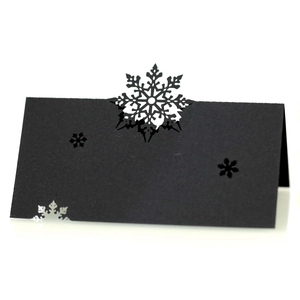 Elegant black laser-cut snowflake place cards for Christmas wedding table decoration
