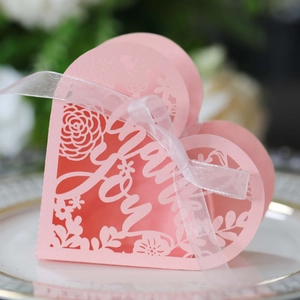 Pink heart laser cut wedding favor box with Thank You text and white ribbon bow