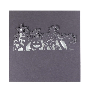 Halloween laser-cut place cards with spooky castle, pumpkin, and witch motifs in black
