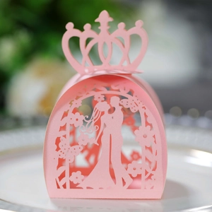 Pink laser cut wedding favor box with a 3D crown and elegant butterfly patterns