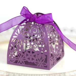 Elegant purple laser-cut candy box with floral patterns and a matching organza ribbon bow