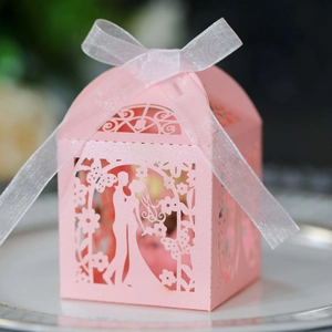 Elegant laser cut pink wedding candy box with bride and groom silhouette and ribbon