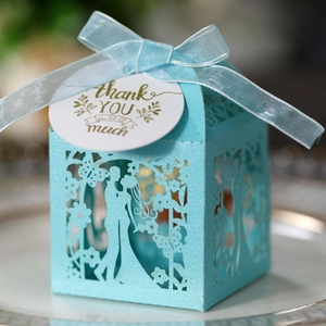 Laser cut light blue wedding favor box with bride groom silhouette and ribbon