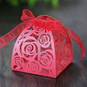 Red laser-cut rose gift box with ribbon for wedding candy and chocolate packaging
