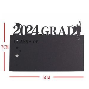 Detail of 2024 graduation laser cut place card with 2024 GRAD text and hat silhouette