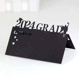 Detail of laser-cut 2024 graduation place card with Class of 2024 text and hollow cap