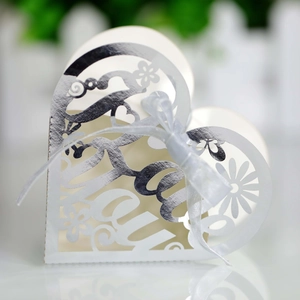 Off-white heart-shaped gift box with silver Thank You laser-cut text and a white ribbon